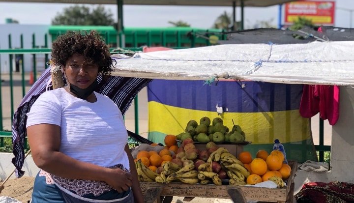 woman selling vegetables on a stall