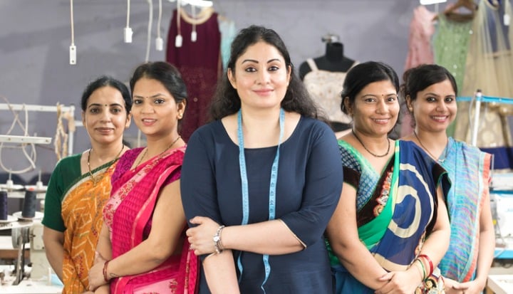 female-textile-workers-standing-together-in-solidarity-at-factory