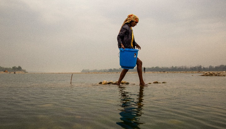 Kopila Tharu fishing in a traditional way in the Karnali Rive