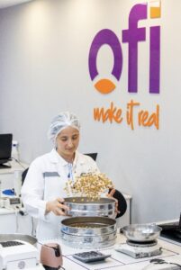 A member of the quality team at ofi's Piraziz processing facility