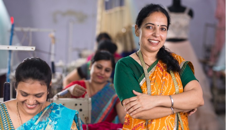 Women and Garment Industry- Indian women in textiles factory with arms crossed