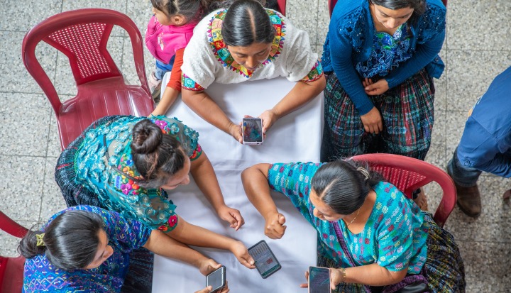 guatemala - women looking at mobile phones